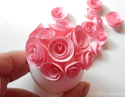 Gluing Pink Rosettes to Egg