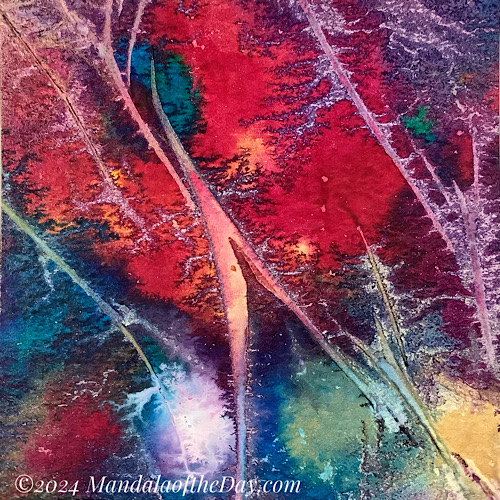 blobby abstract background of reds, greens, yellows, and white with some wrinkled textured lines,