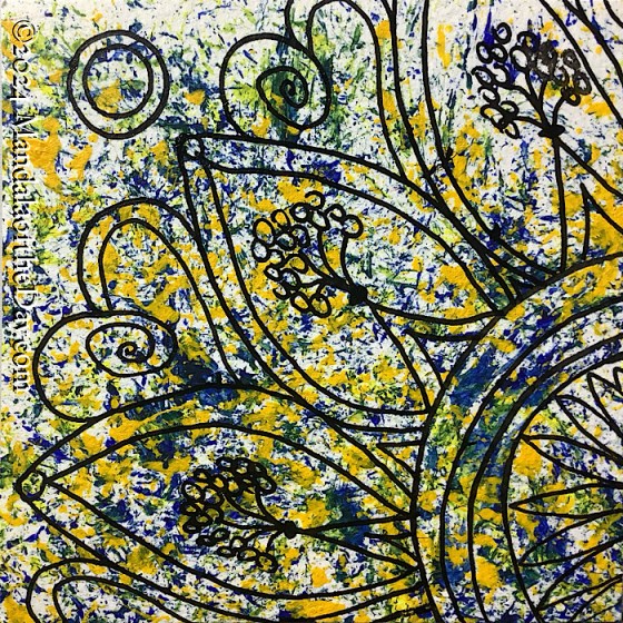 MotD 24-268 Consideration — after. busy abstract background with small dabs of colors in yellow, olive green, and indigo on a background of white. on top in black ink is the upper left quadrant of a mandala whose center is off the paper and down to the right. within the center circle portion are daisy-like petals, then three outer rings, then we see three of the possible 12 large petals around the outside. within the petals is a triangle shape like a vase holding a bouquet of simple flowers (mini circles). in between the petals are large hearts with a spiral in them.