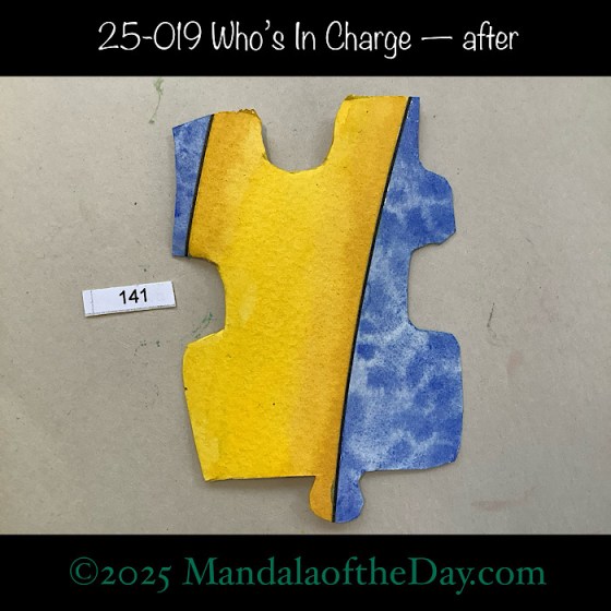 MotD 25-019 Who’s In Charge — after. Painted front side of Puzzle Piece No. 141 with colors of blue and yellow