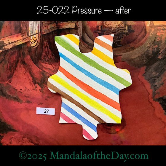 MotD 25-022 Pressure — after. Painted front side of Puzzle Piece No. 27. diagonal stripes of colors, upper left down to lower right using green, blue, yellow, brown, red…white stripes painted in between each color stripe.
