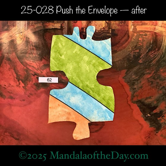 MotD 25-028 Push the Envelope — painted front view of Puzzle Piece No. 62. with colors of light reddish brown, blue, and green.